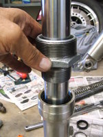 Seating the shock seal using the 1-1/2-inch IPS end as a sliding hammer.