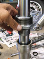 Seating the shock seal using the 1-1/2-inch IPS end as a sliding hammer.